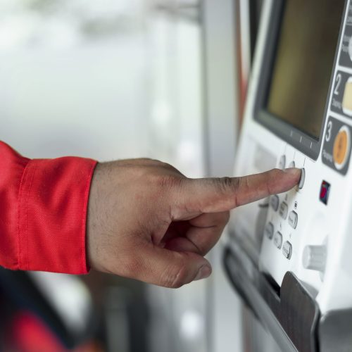 side-view-hand-pressing-button
